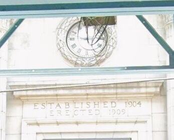Clock above the entrance to the old Textile National Bank