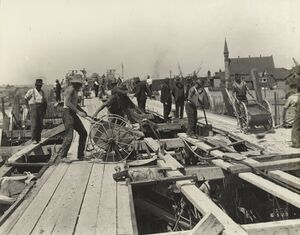 503 Pouring arc rib of 120ft arch approximately 500 cubic yards of concrete were poured in one day. 6-3-1929