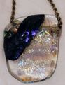 Golden Boot award from Rick Hawes, a handblown glass necklace made by our own Skip Rognlien (Times Squares) and inscribed on the back with: GOLDEN BOOT 2004 ETT MCATEE