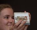 Caitlyn Ceder holds James' Golden Boot Brooch