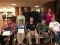 Standing (L-R): Maggie Neely, Brian Gunn, Dayle Hodge, caller, Steve Clark, and Sheila Kraft. Seated: Bill Reed, Kate Blom, Scott MacLeod, Henry Lee II, and Sandy Snider. At Lifetime Membership Awards, 2019.