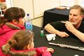 Camellia Symphony flutist Ralph Padgug demonstrates the mouth piece of a flute, 2012