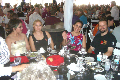 Women seated at convention banquet.