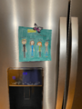iNext (2021-2022) cast drawing on Sandra's refrigerator