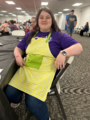 Rachel wearing Tina's green and yellow apron on March 24, 2026